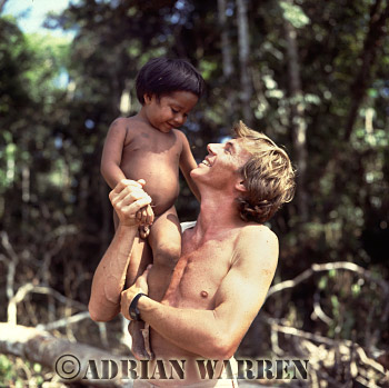 AW_Waorani24, Waorani Indians, a child with Adrian Warren, Rio Cononaco, Ecuador, 1983